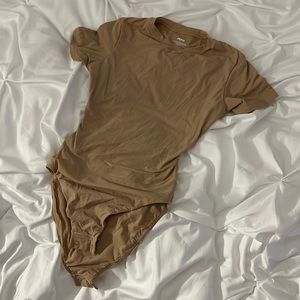 Skims body suit nude